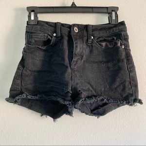 Distressed high rise black shorts w raw hem black